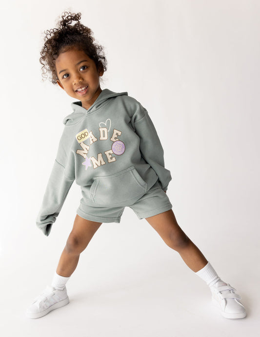 Kids' short by Elevated Faith featuring a "God Made Me" design, comfortable casual wear for children.