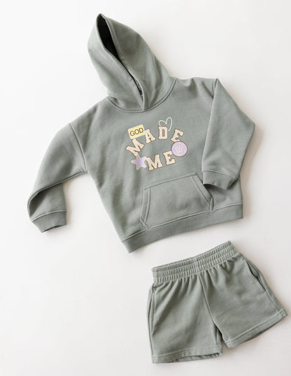 Kids' God Made Me shorts by Elevated Faith featuring colorful, comfortable fabric design for children.