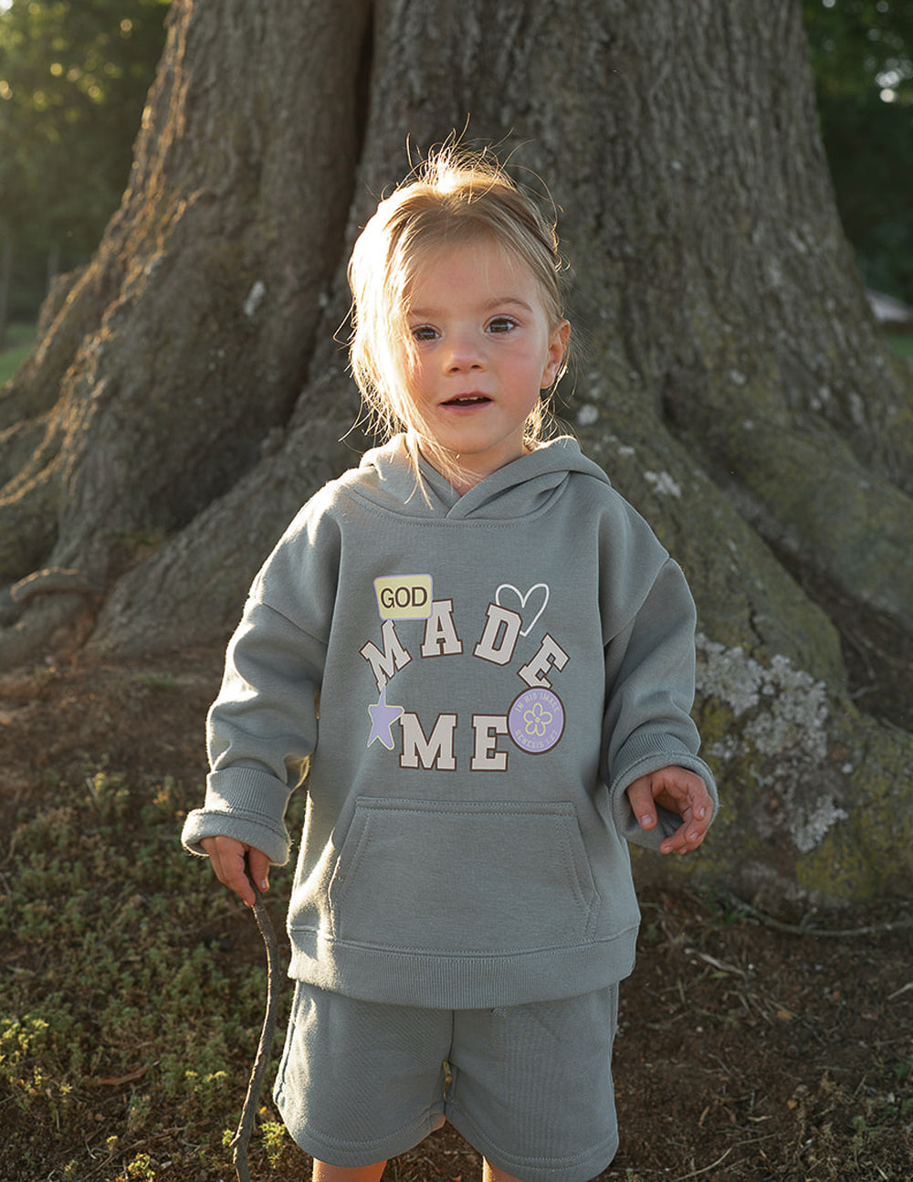 Kids shorts featuring "God Made Me" print by Elevated Faith, casual kids clothing with colorful, comfortable design.