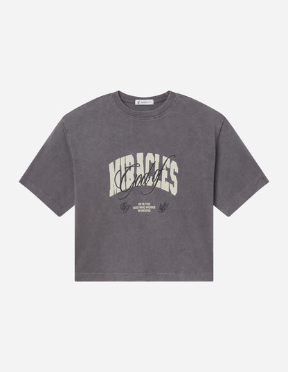 Elevated Faith God of Miracles cropped women's T-shirt with inspirational text and stylish fit, shown on a white background.