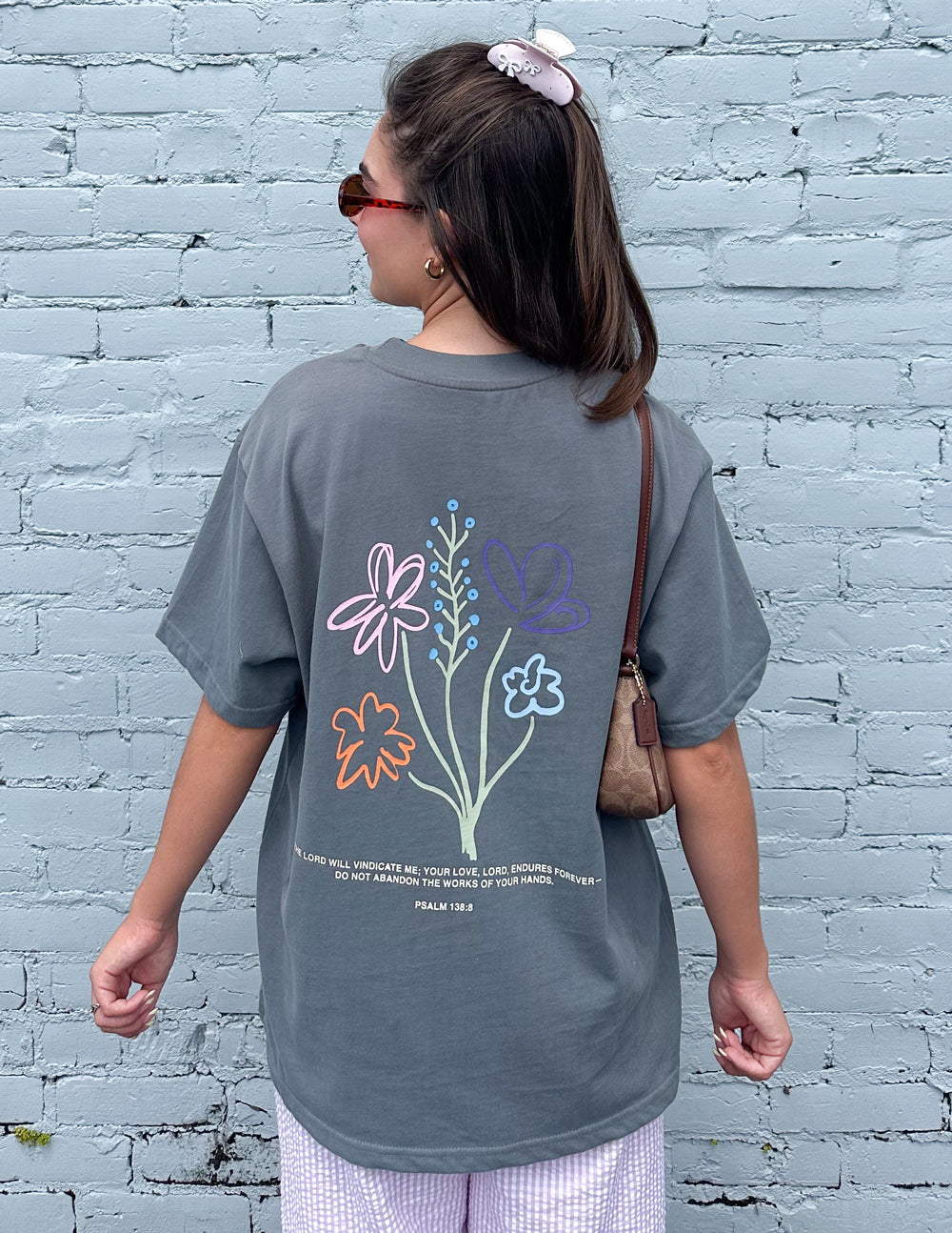 Unisex T-shirt by Elevated Faith with God's Still Working graphic design, casual fit and comfortable fabric.