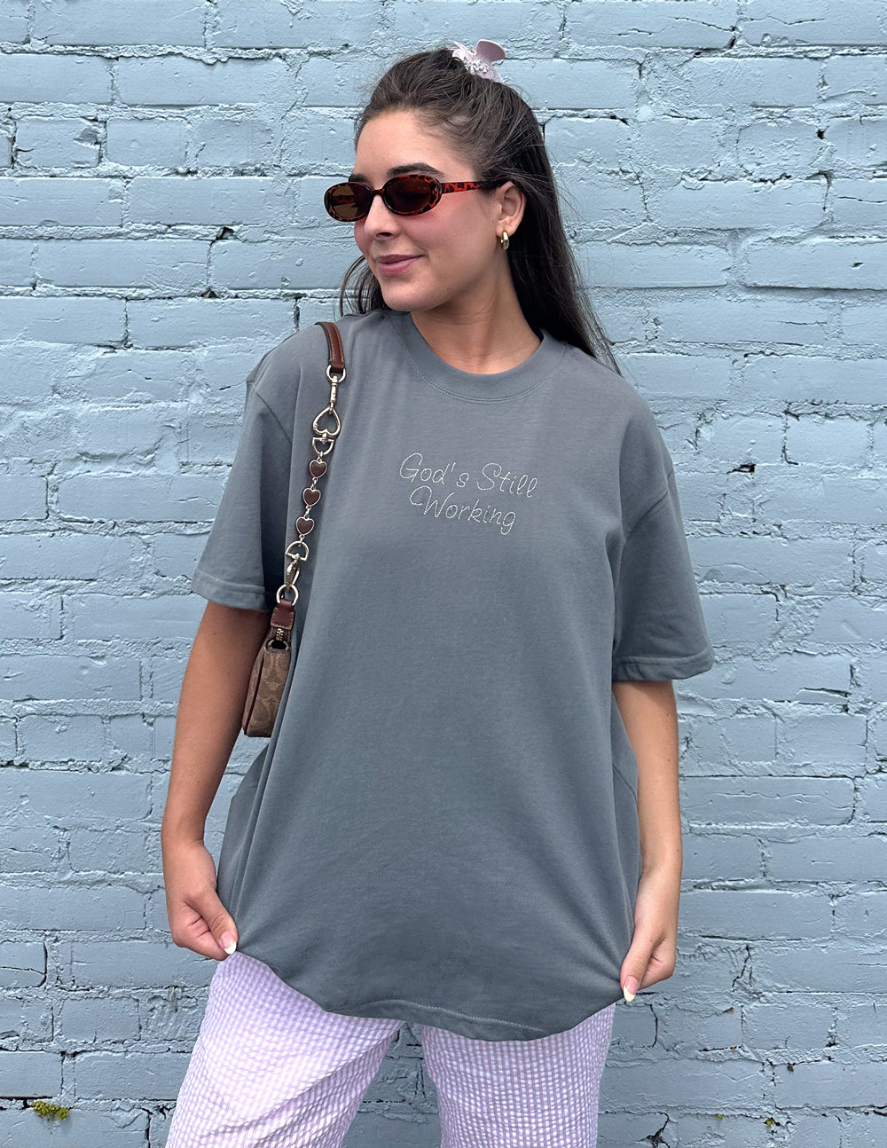 Unisex T-shirt by Elevated Faith featuring a spiritual design related to God's still working message.