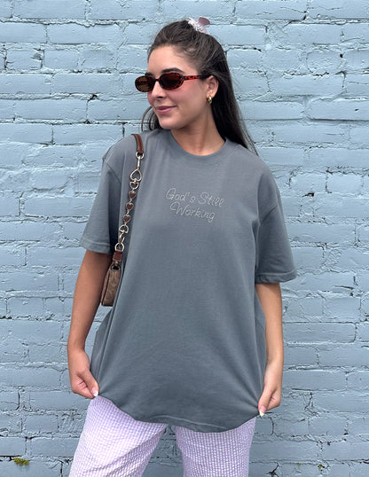 Unisex T-shirt by Elevated Faith featuring a spiritual design related to God's still working message.