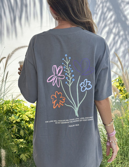 Unisex T-shirt with "God's Still Working" print by Elevated Faith, featuring a comfortable fit and faith-inspired design.