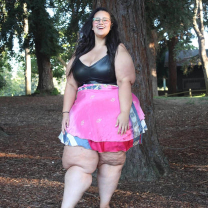 Darn Good Yarn Made With Love goddess sari wrap skirt in vibrant fabric, styled as a mini wrap skirt for a boho look.