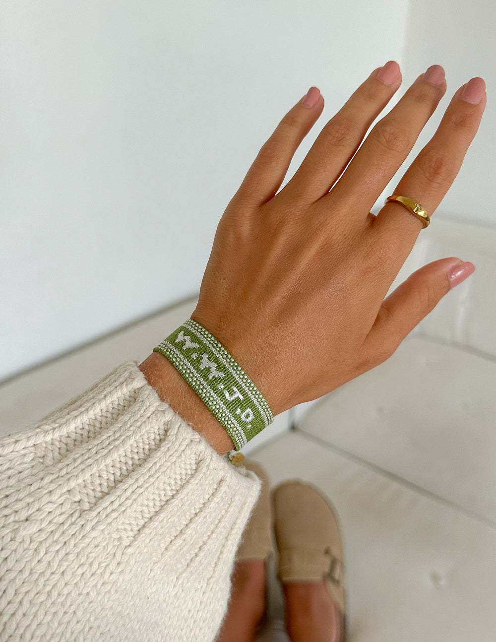 Green WWJD embroidered wristband bracelet by Elevated Faith featuring stitched religious message on fabric band.