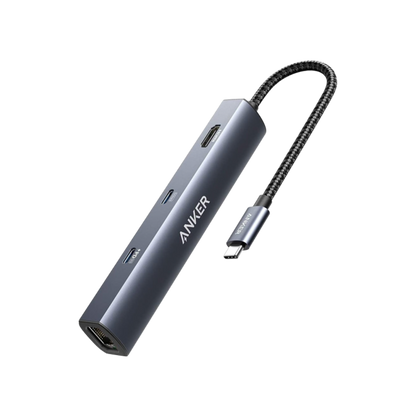 Anker 543 USB-C Hub 6-in-1 slim charging station with multiple ports, shown with connected devices on a sleek surface.