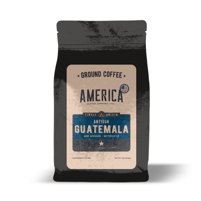 Ground Guatemala single origin coffee from America Supply Company LLC, showing rich, dark roasted beans in a bag.
