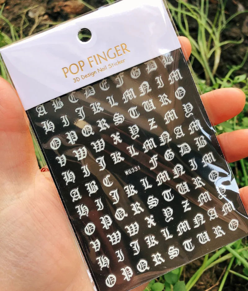 Black Gothic alphabet nail art stickers by Blushimmer featuring Old English font for decorative nail designs.