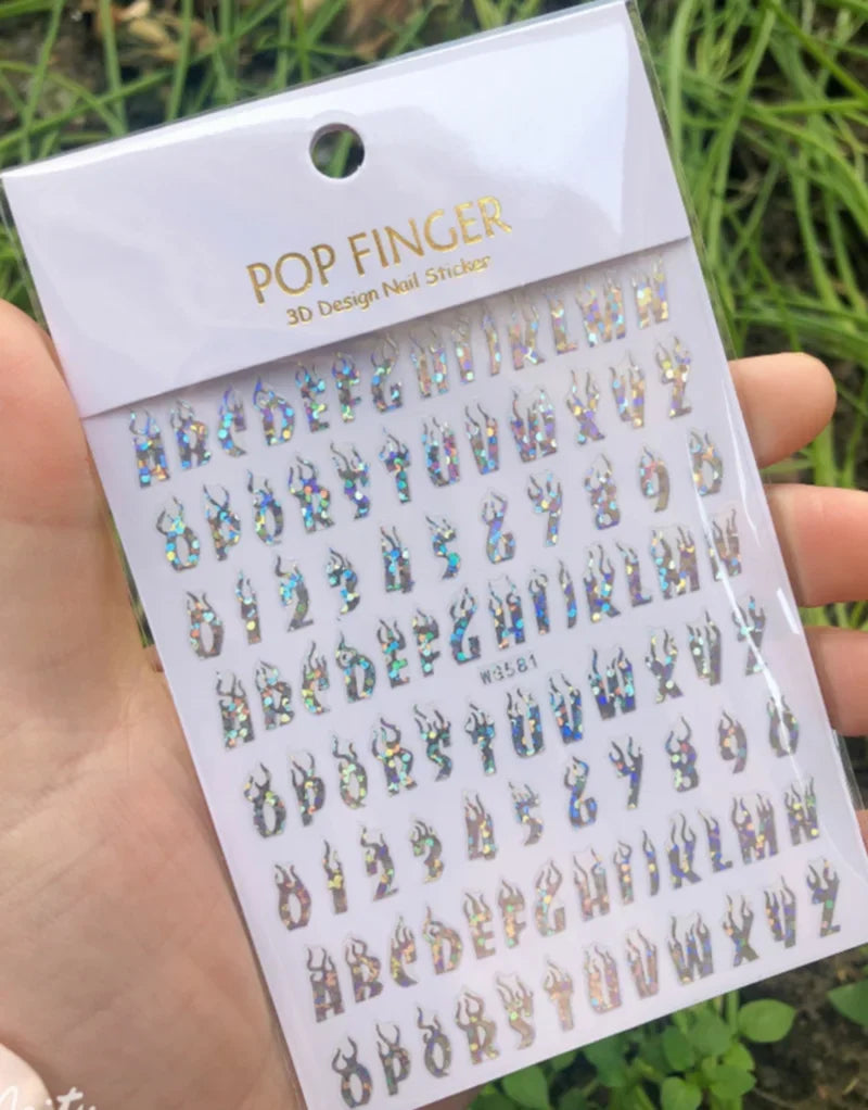 Black Old English font nail art stickers featuring alphabet letter transfers for gothic and gothic-inspired nail decoration.