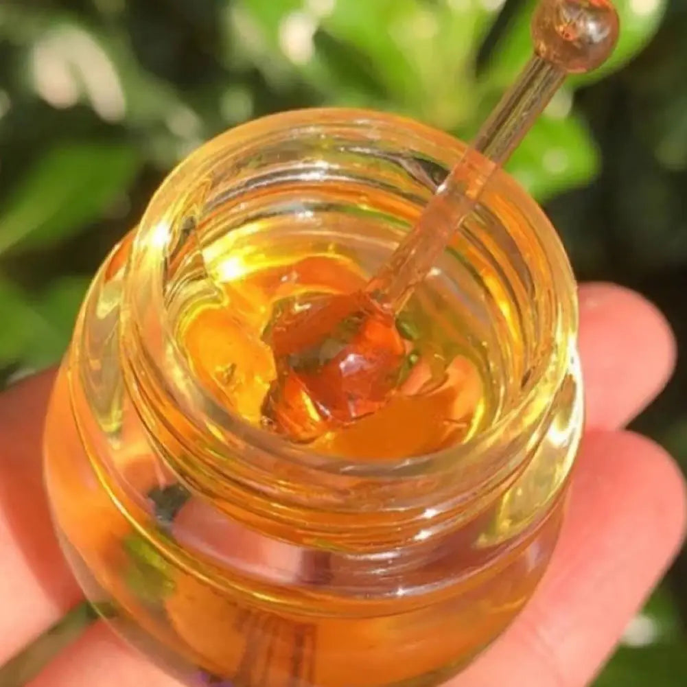 Blushimmer organic beeswax honey lip balm in a jar, moisturizing and hydrating lip butter for dry, chapped lips.