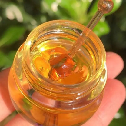 Blushimmer organic beeswax honey lip balm in a jar, moisturizing and hydrating lip butter for dry, chapped lips.