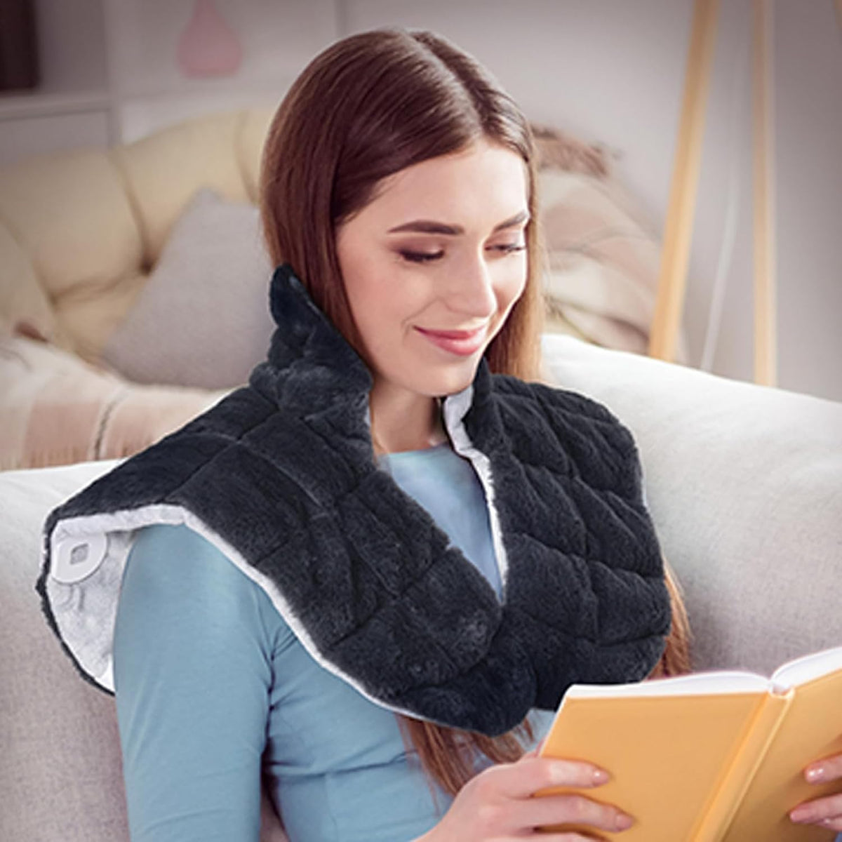 iReliev weighted heating pad for neck and shoulders, with soft fabric cover and adjustable strap for targeted pain relief.