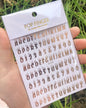 Black Old English font nail art stickers featuring alphabet letter transfers for gothic and gothic-inspired nail decoration.
