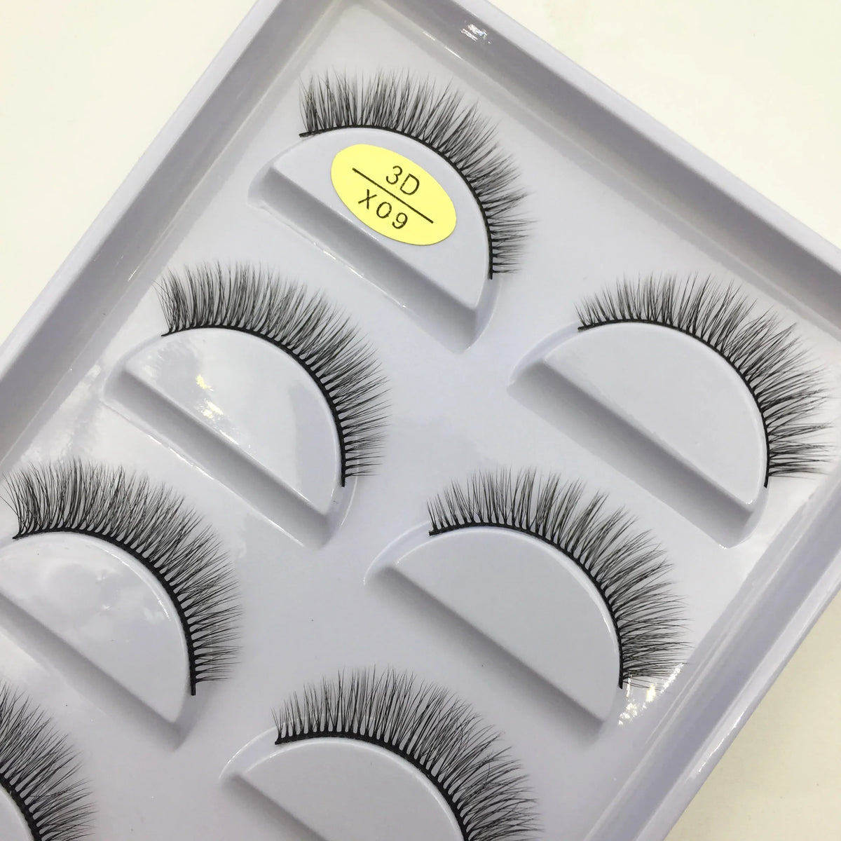 Set of five 3D mink false eyelashes by Blushimmer, natural and voluminous eyelash extensions for makeup and beauty application.