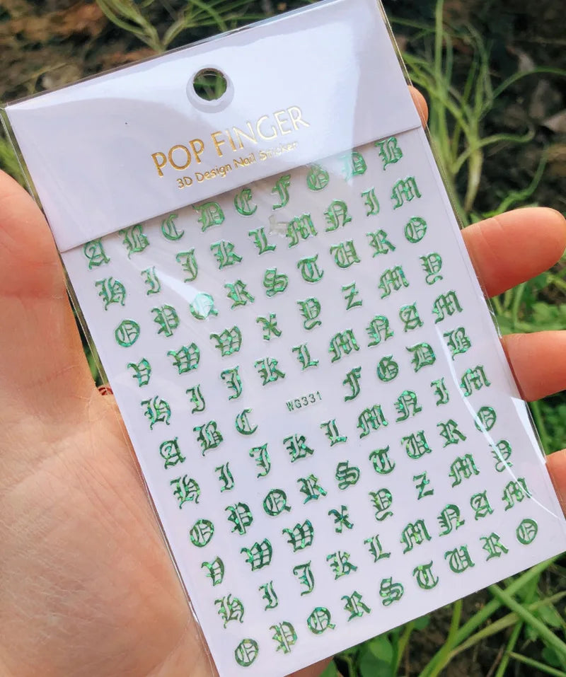 Black Gothic alphabet nail art stickers with Old English font, ideal for nail decoration and gothic nail designs.