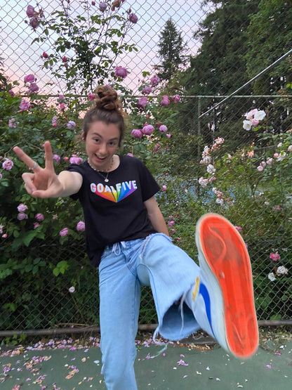 Black cotton Superhuman T-shirt by Goal Five, featuring a comfortable fit and lifestyle design, worn by Hailey in the image.
