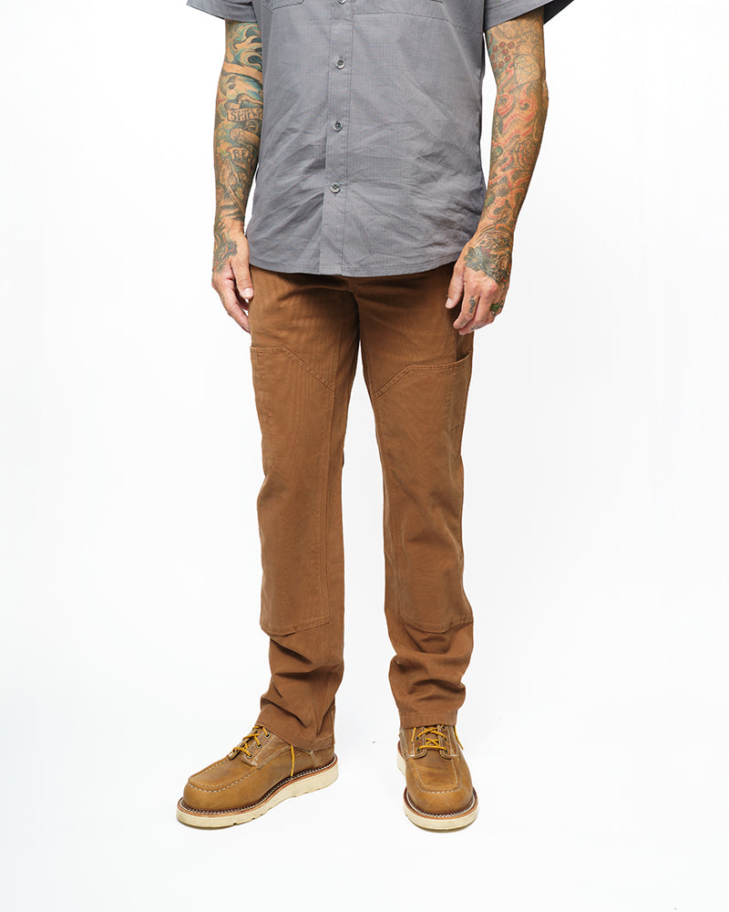 Off The Grid Surplus Hardened Double Knee Pants in tobacco color, featuring durable fabric and reinforced knee areas.