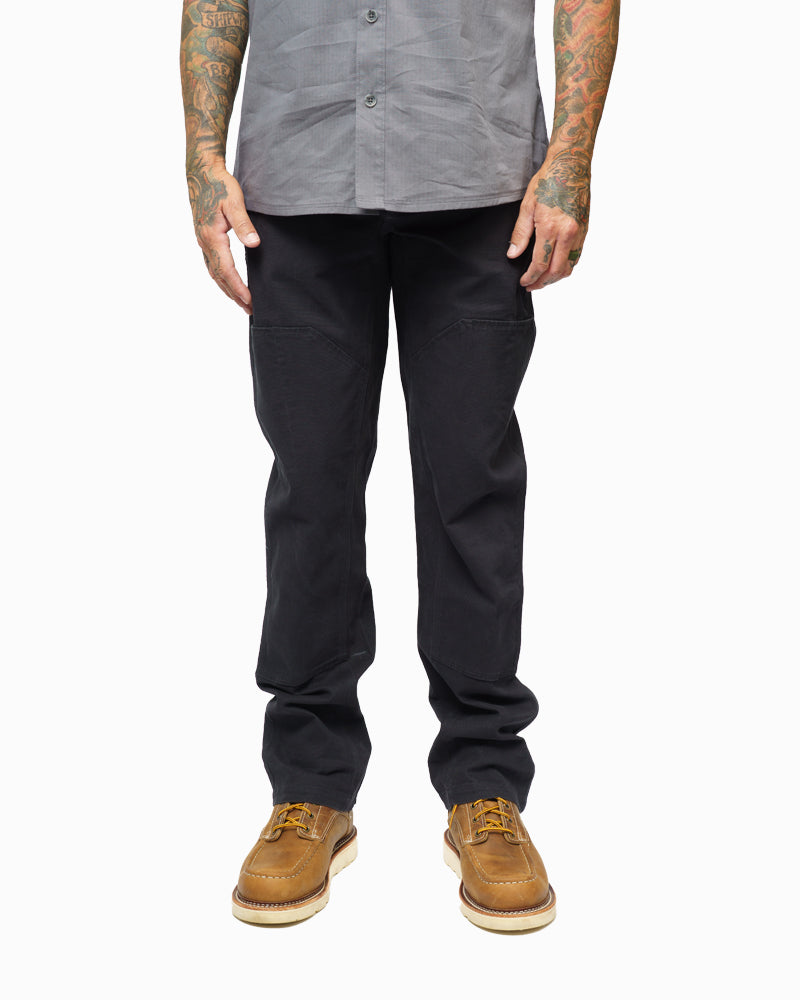 Black hardened double knee pants by Off The Grid Surplus, durable workwear with reinforced knees and rugged fabric.
