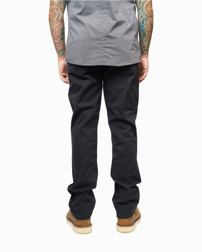 Black hardened double knee pants by Off The Grid Surplus, durable workwear with reinforced knees, front and back pockets.
