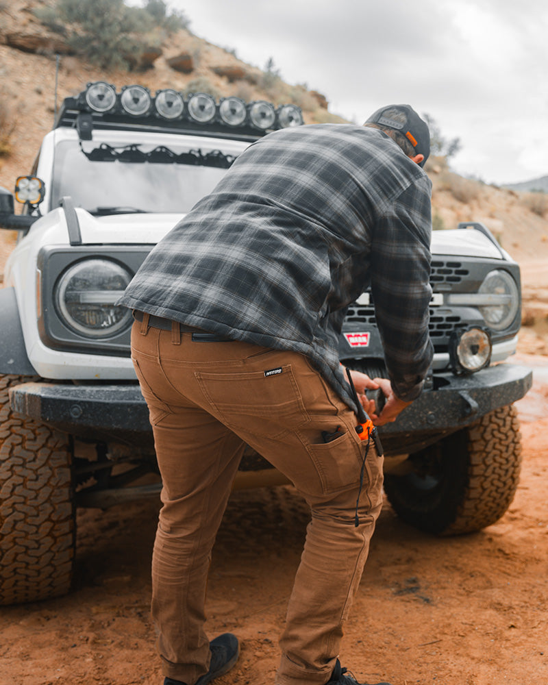 Off The Grid Surplus hardened double knee pant showing durable fabric and reinforced knees in a natural stance.