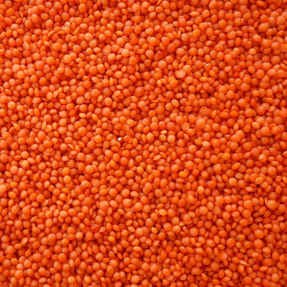 Red lentils in a 1kg bag from S101, showcasing bright orange-red lentil grains in a clear view.