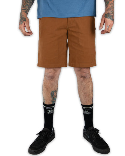 Off The Grid Surplus Havok Shorts 10-inch in tobacco color, featuring durable fabric and casual fit, shown on a model.