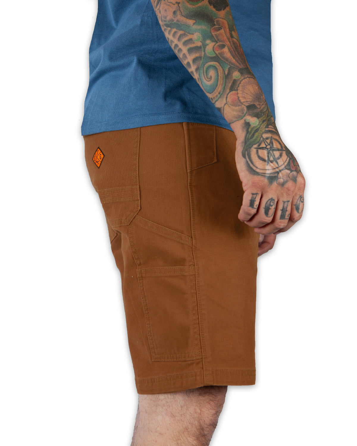 Off The Grid Surplus Havok Shorts 10-inch in Tobacco color, featuring a casual fit and durable fabric, displayed on a mannequin.