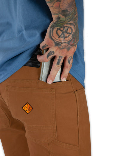 Off The Grid Surplus Havok Shorts 10-inch in tobacco color, featuring durable fabric and casual fit, displayed on a hanger.