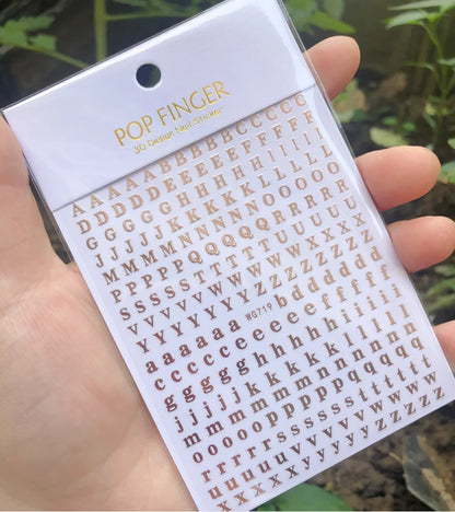 Black Old English font nail art stickers featuring alphabet letter transfers for gothic and gothic-inspired nail decoration.