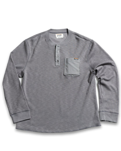 Long-sleeve Henley shirt in Castlerock color by Off The Grid Surplus, featuring a casual fit and buttoned neckline.