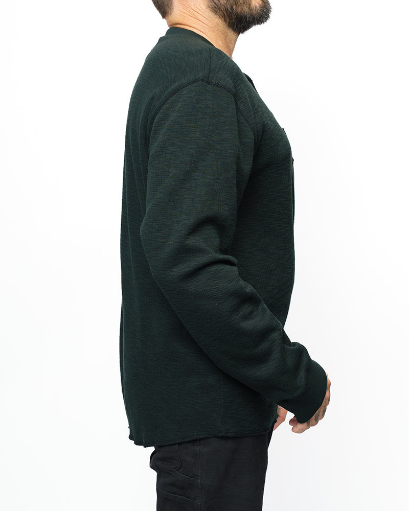 Vintage black Draper Henley long sleeve shirt by Off The Grid Surplus, displayed on a hanger with a casual fit.