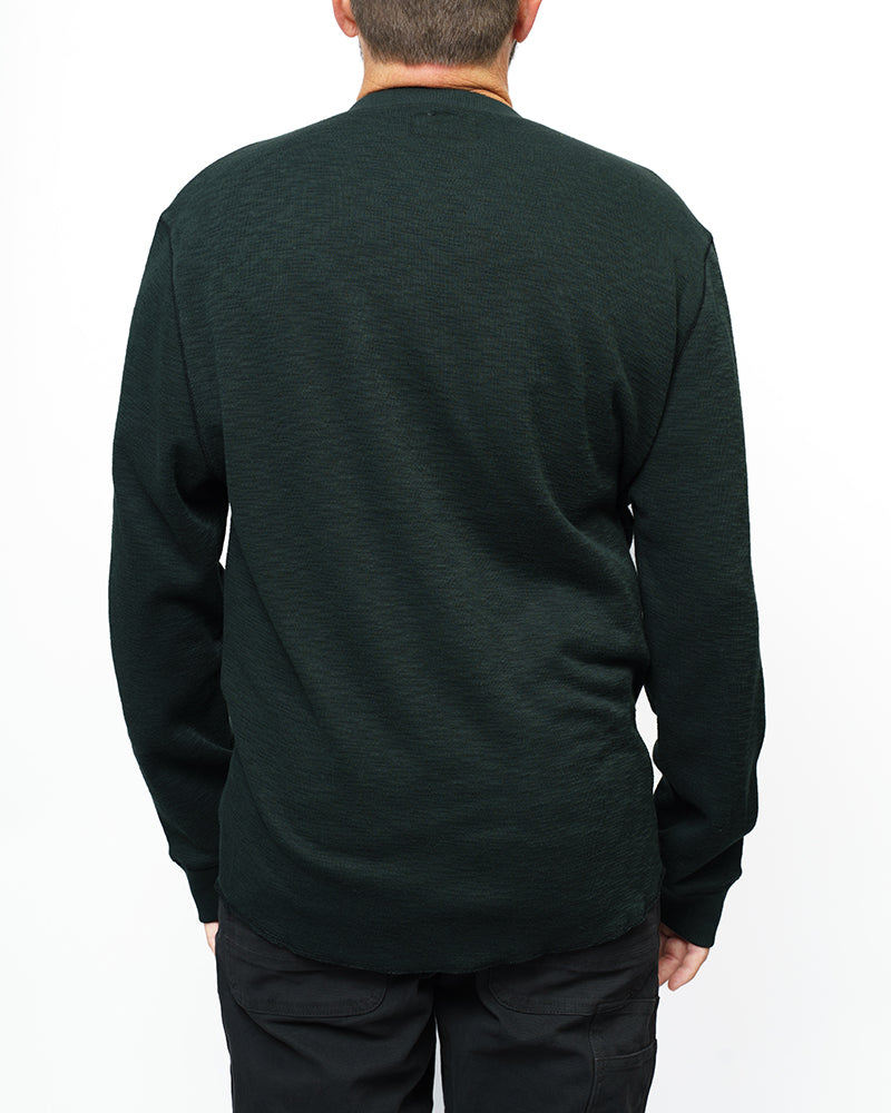 Vintage black Draper Henley long-sleeve shirt by Off The Grid Surplus, featuring a classic Henley neckline and comfortable fit.