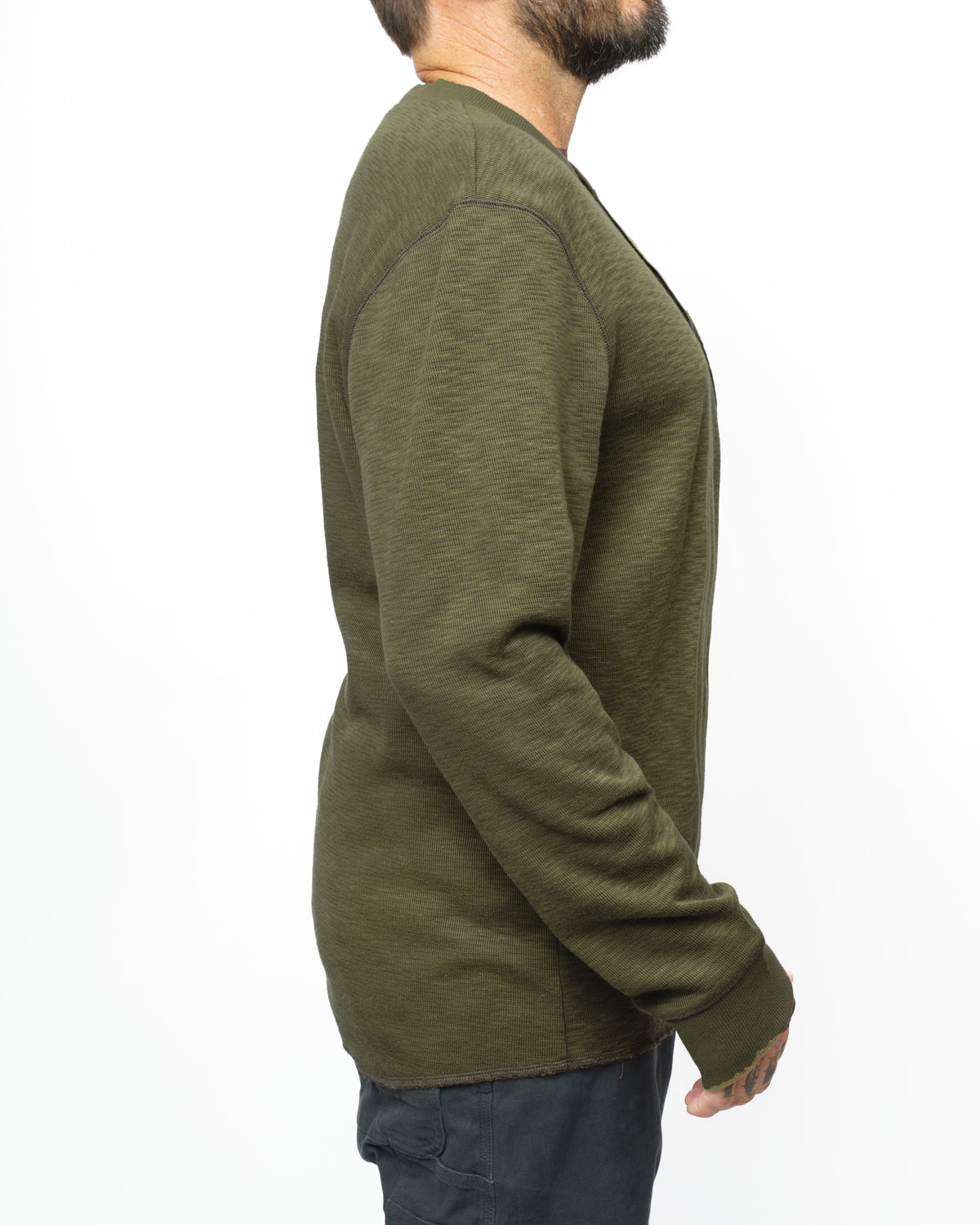 Dark olive Draper Henley long sleeve shirt by Off The Grid Surplus, showing the front view with buttons and collar.