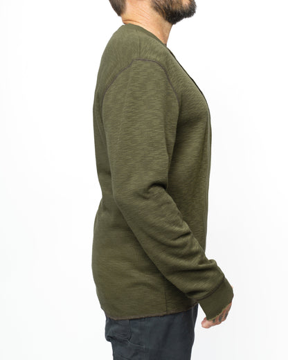 Dark olive Draper Henley long sleeve shirt by Off The Grid Surplus, showing the front view with buttons and collar.