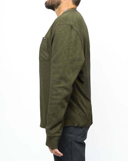 Dark olive Draper Henley long-sleeve shirt by Off The Grid Surplus, featuring a classic henley style with button placket and casual fit.