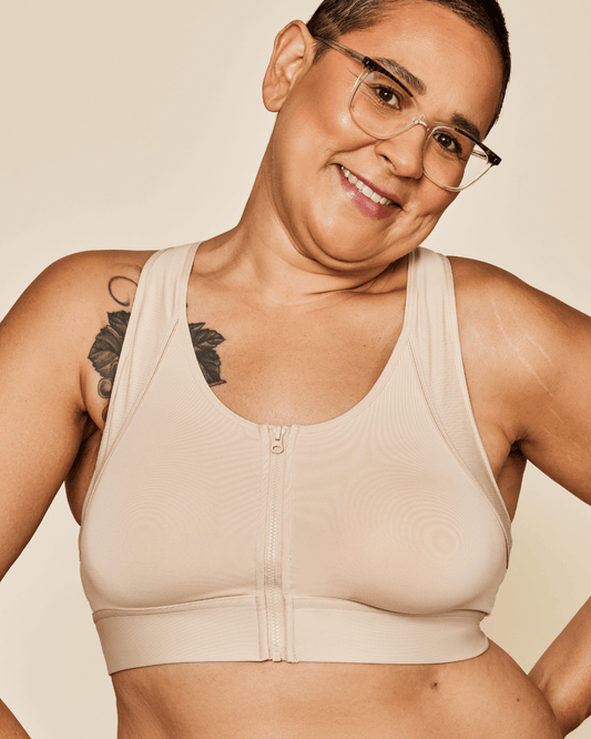 Meadow Hero front-closure sports bra in buff color, featuring supportive design and adjustable straps for active wear.