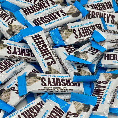Hershey's Cookies 'n' Creme chocolate snack size candies in a bulk value bag, with creamy filling and cookie pieces visible.
