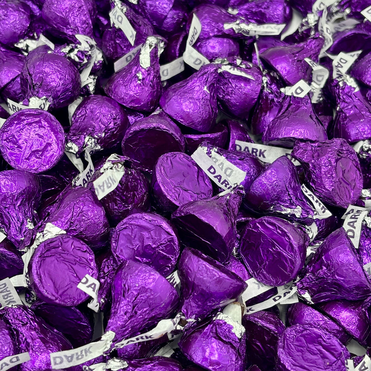 Hershey's Kisses Special Dark Mildly Sweet Chocolate candies in a bulk value bag, featuring individual foil-wrapped chocolates.