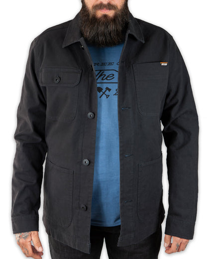 Black Heston Chore Coat jacket by Off The Grid Surplus displayed on a mannequin, showcasing its durable fabric and classic design.