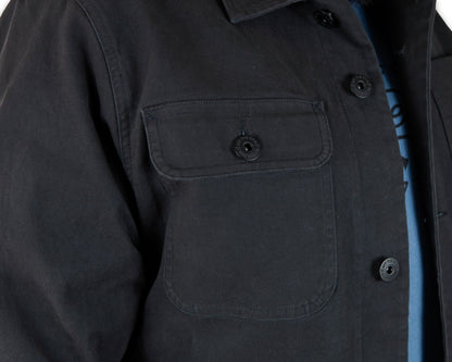 Black Heston Chore Coat by Off The Grid Surplus, a durable jacket with a classic workwear style and functional design.