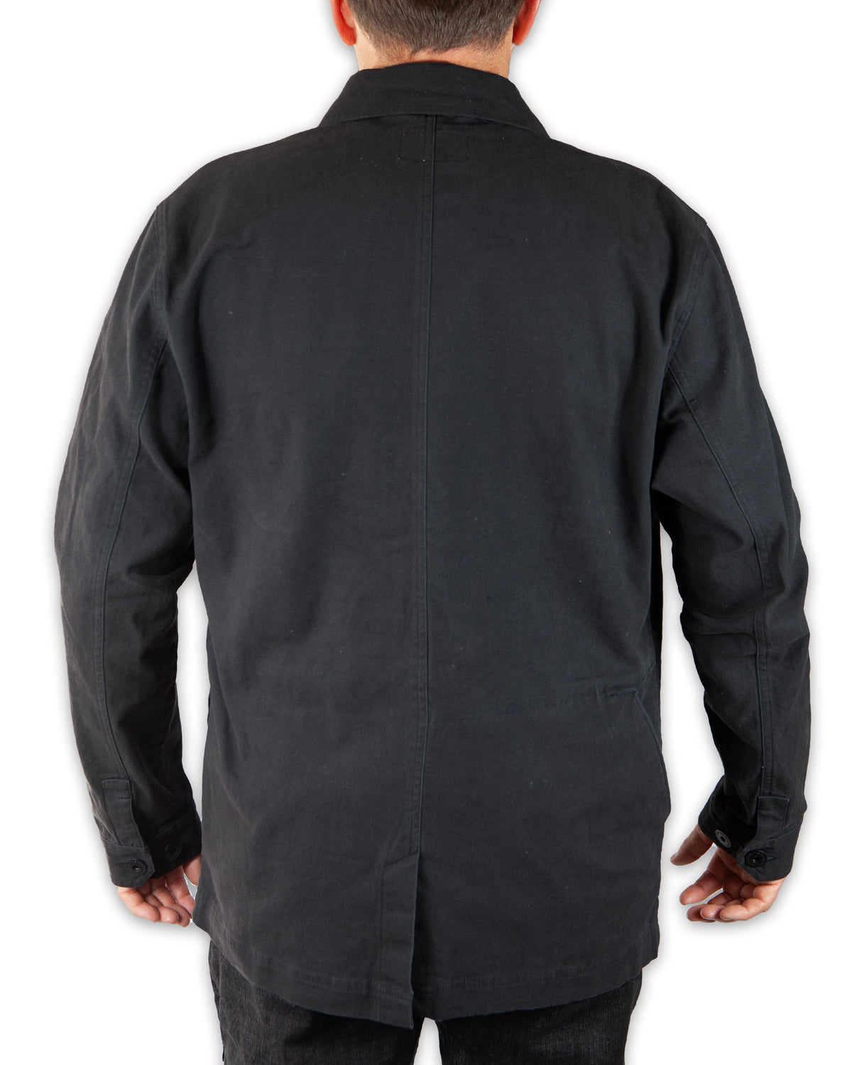 Black Heston Chore Coat by Off The Grid Surplus, featuring durable fabric and classic workwear style, shown on a hanger.