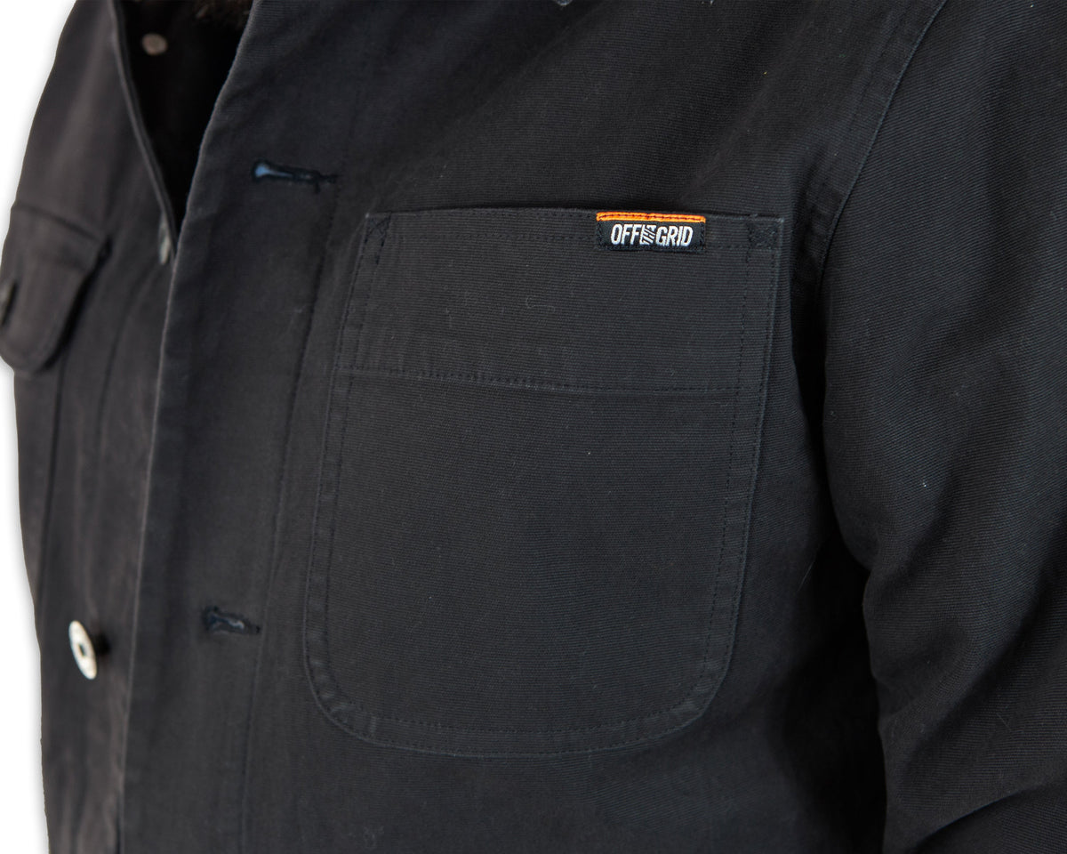 Black Heston Chore Coat jacket by Off The Grid Surplus, featuring durable fabric and classic workwear style.