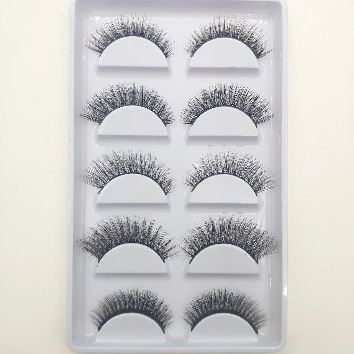 Set of five 3D mink false eyelashes by Blushimmer, natural-looking, full lash style for makeup and beauty enhancement.