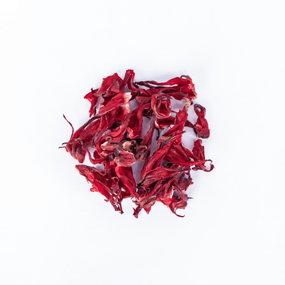 Organic Nepal Tea hibiscus blend with vibrant red hibiscus flowers and leaves, showcasing fresh, natural ingredients for herbal tea.