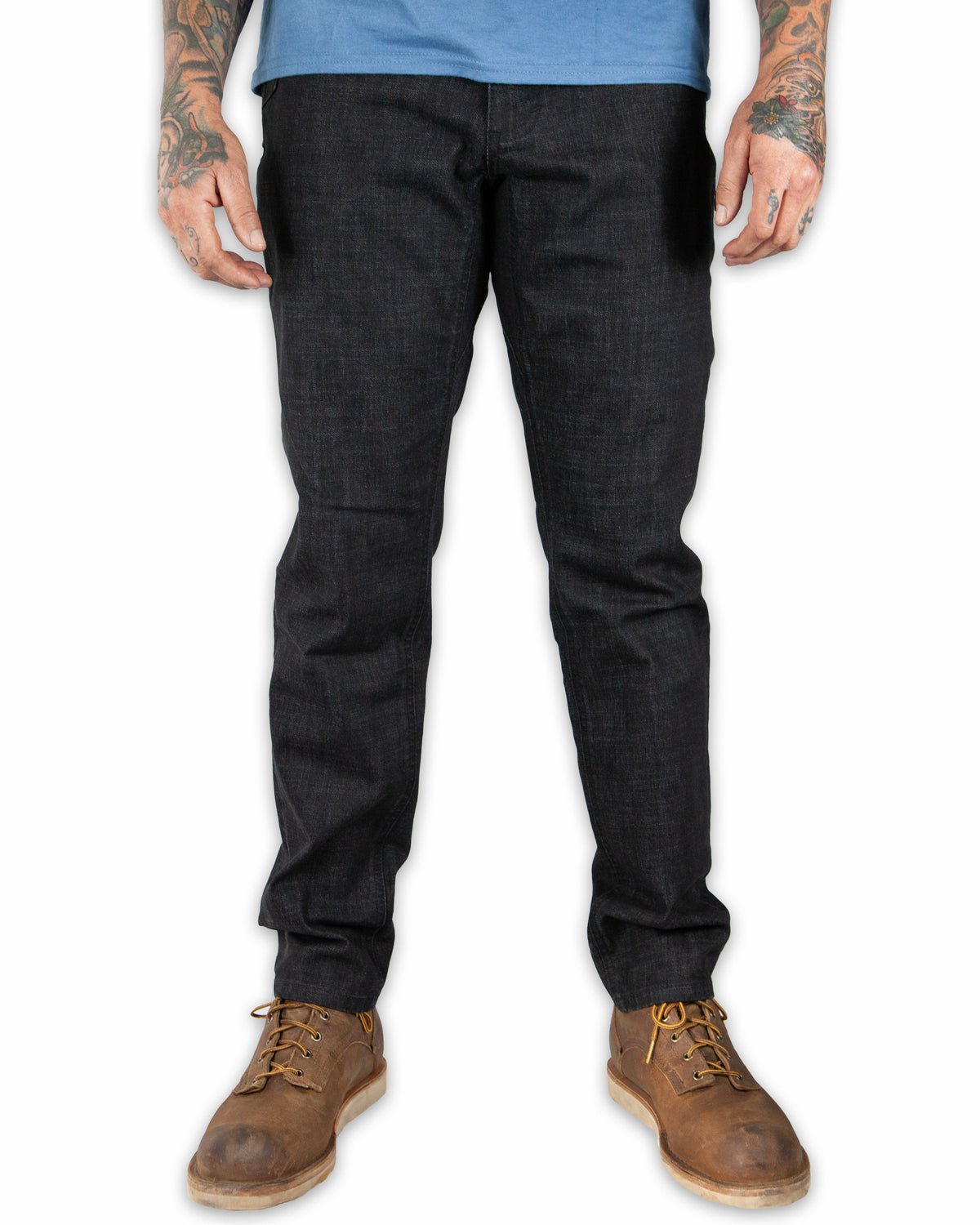 Black denim taper fit pants from Off The Grid Surplus, featuring a sleek design and classic five-pocket style.