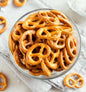 AmBari Nutrition high-fiber protein pretzels, crunchy snack with added fiber and protein, in a close-up view showing the pretzel texture.