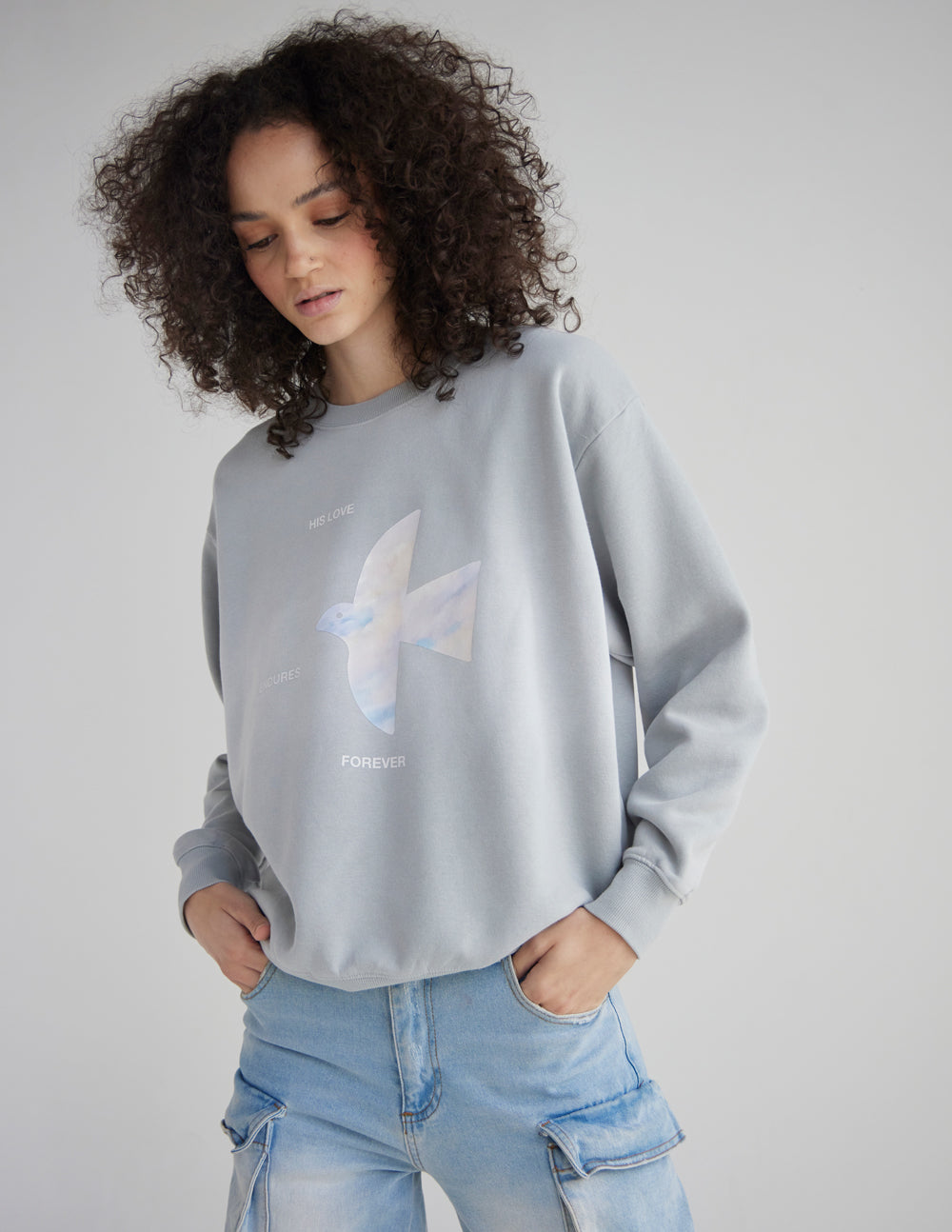 Unisex crewneck sweatshirt with "His Love Endures Forever" print by Elevated Faith, shown in a casual front view.