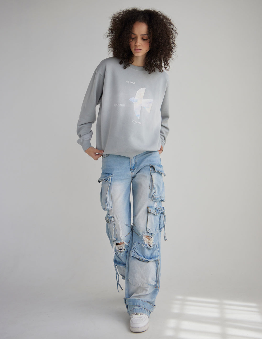Unisex crewneck sweatshirt with "His Love Endures Forever" printed on the front, by Elevated Faith, casual and comfortable.