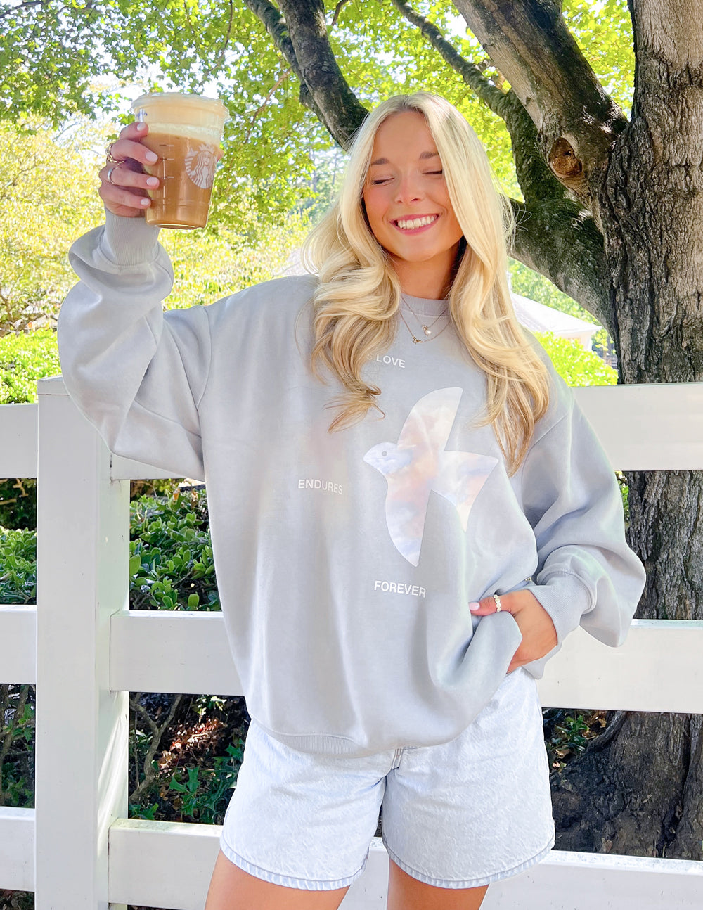 Unisex crewneck sweatshirt with "His Love Endures Forever" printed in black on light-colored fabric by Elevated Faith.